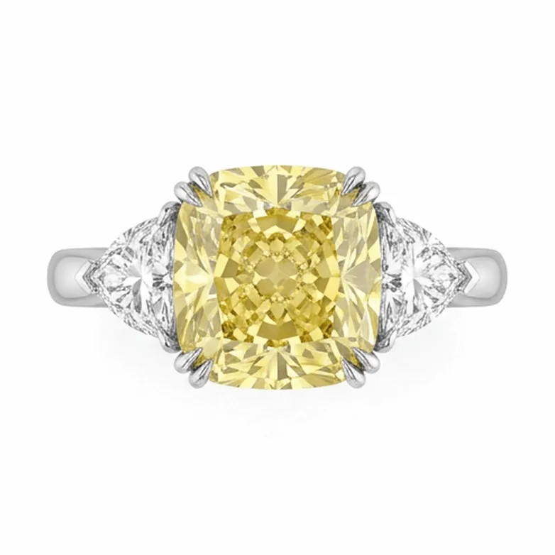Fancy Yellow Cushion Three-Stone with Trillion Side Diamonds in Platinum