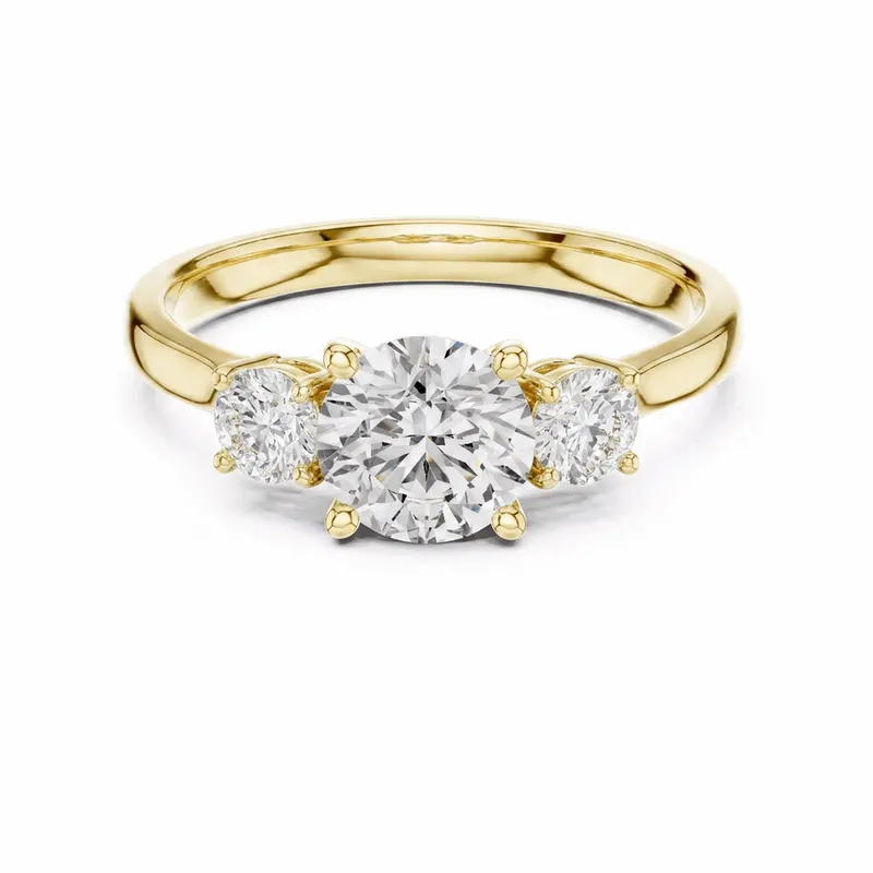Cushion Cut Three-Stone Diamond Engagement Ring in Yellow Gold