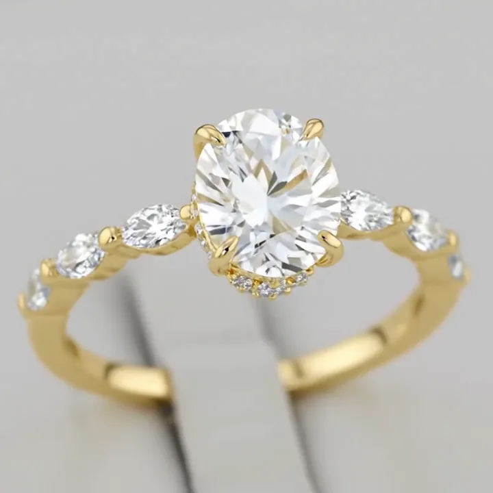 Oval Cut Hidden Halo with Marquise & Pavé Shank in Yellow Gold
