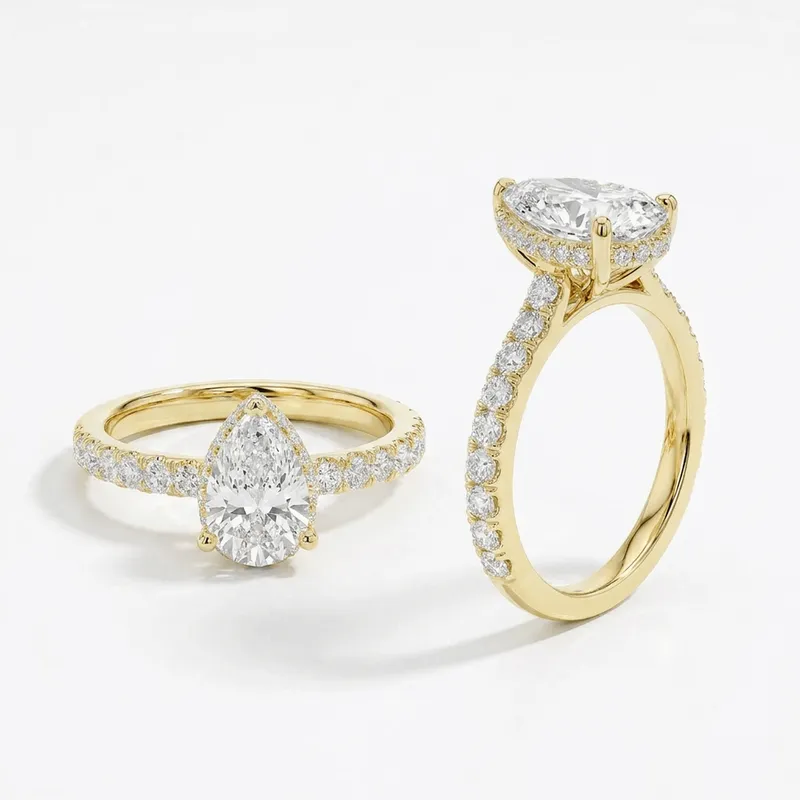 Pear Cut Hidden Halo with Pavé Shank Engagement Ring in Yellow Gold